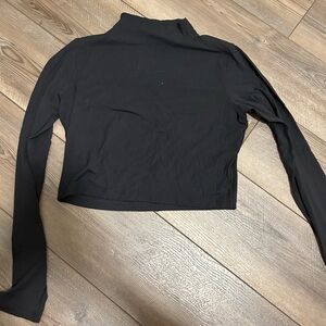 Lulu lemon long sleeve in a size tan. It’s a buttery soft material.